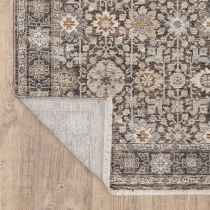 8' X 11' Charcoal Ivory and Beige Floral Power Loom Area Rug With Fringe