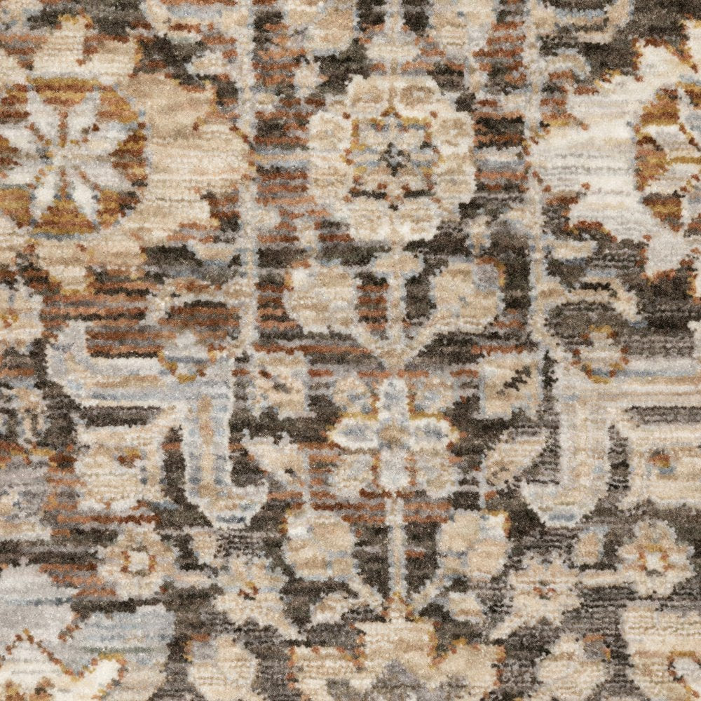 8' X 11' Charcoal Ivory and Beige Floral Power Loom Area Rug With Fringe