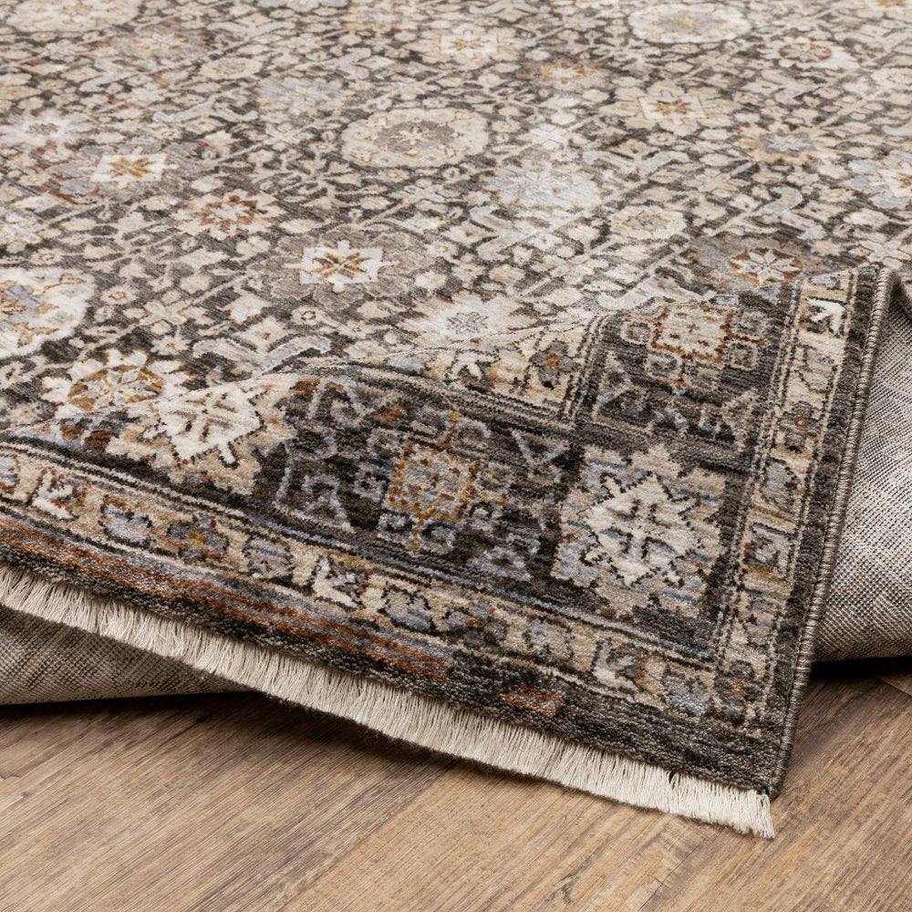 8' X 11' Charcoal Ivory and Beige Floral Power Loom Area Rug With Fringe