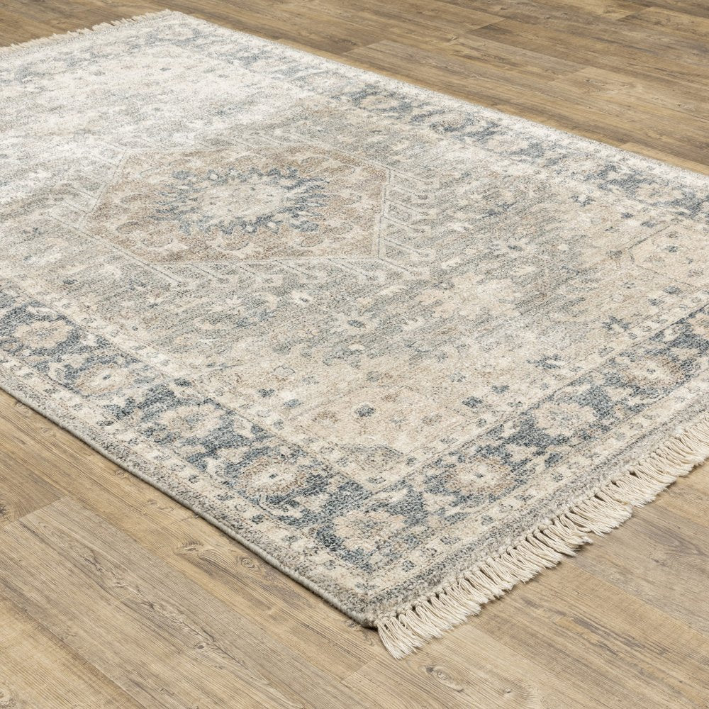 5' X 8' Beige And Grey Oriental Hand Loomed Stain Resistant Area Rug With Fringe