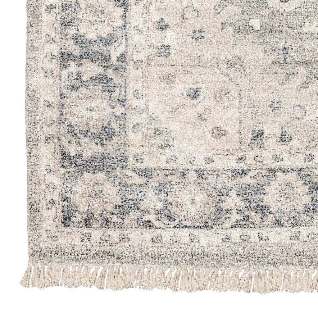 5' X 8' Beige And Grey Oriental Hand Loomed Stain Resistant Area Rug With Fringe