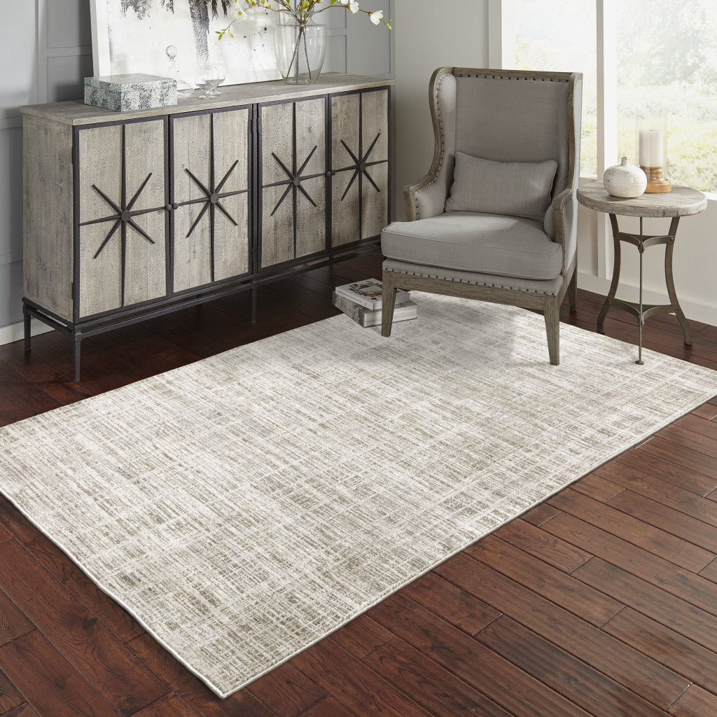 5' X 8' Beige Grey Ivory Tan And Brown Abstract Power Loom Stain Resistant Area Rug