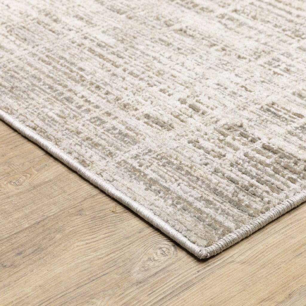 5' X 8' Beige Grey Ivory Tan And Brown Abstract Power Loom Stain Resistant Area Rug