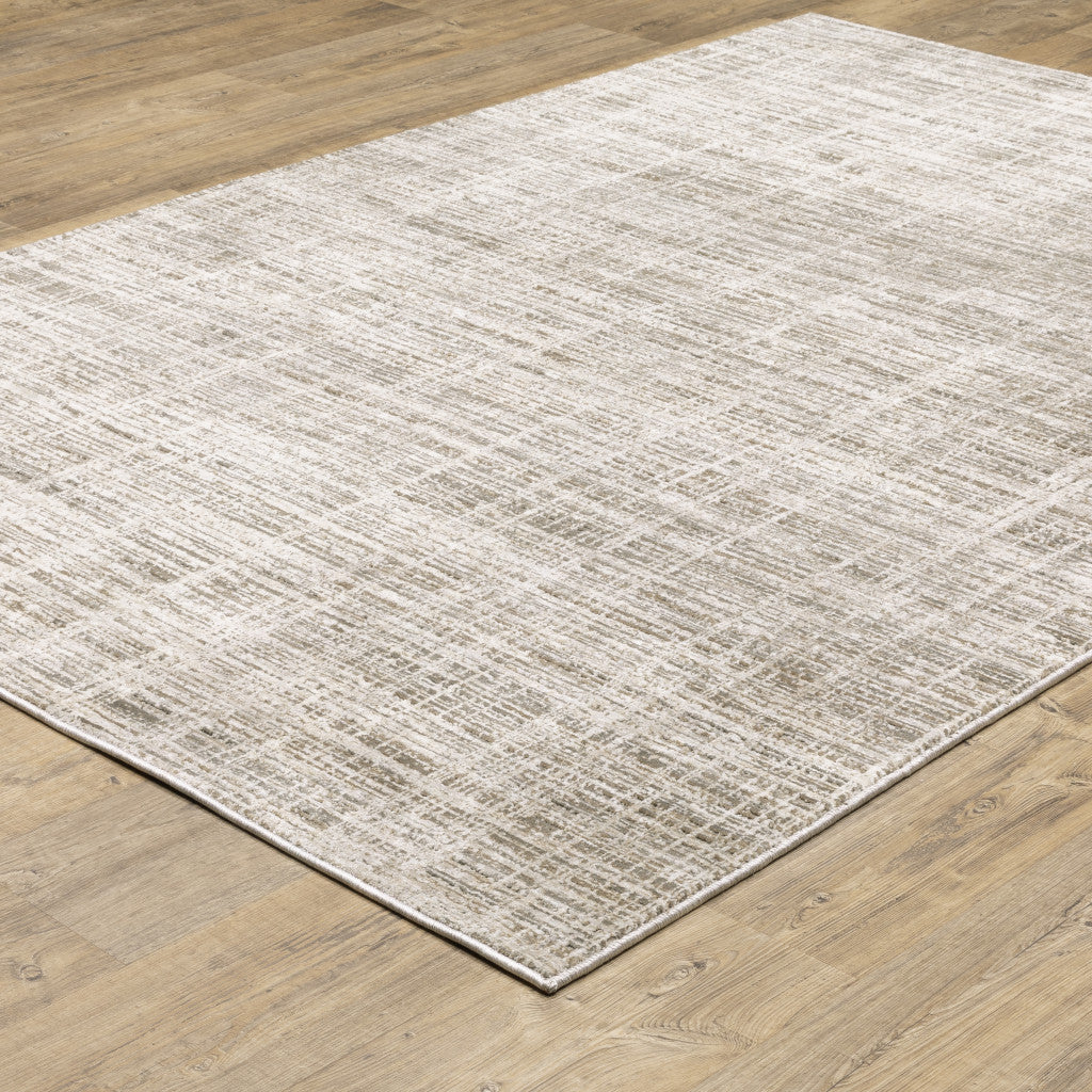 5' X 8' Beige Grey Ivory Tan And Brown Abstract Power Loom Stain Resistant Area Rug