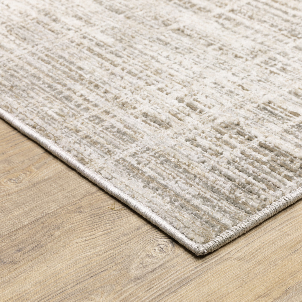 8' X 11' Beige Grey Ivory Tan And Brown Abstract Power Loom Stain Resistant Area Rug