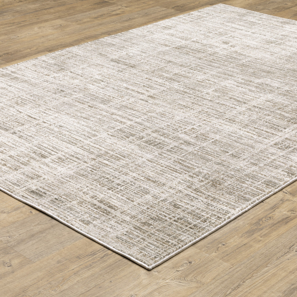 8' X 11' Beige Grey Ivory Tan And Brown Abstract Power Loom Stain Resistant Area Rug