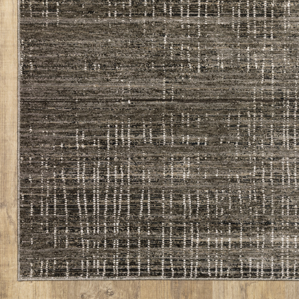 6' X 9' Charcoal Grey Grey Ivory Tan And Brown Abstract Power Loom Stain Resistant Area Rug