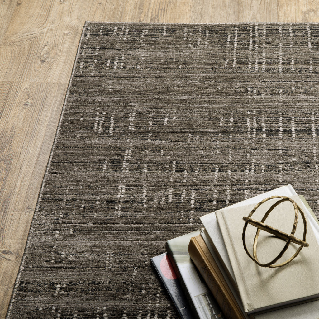 8' X 11' Charcoal Grey Grey Ivory Tan And Brown Abstract Power Loom Stain Resistant Area Rug