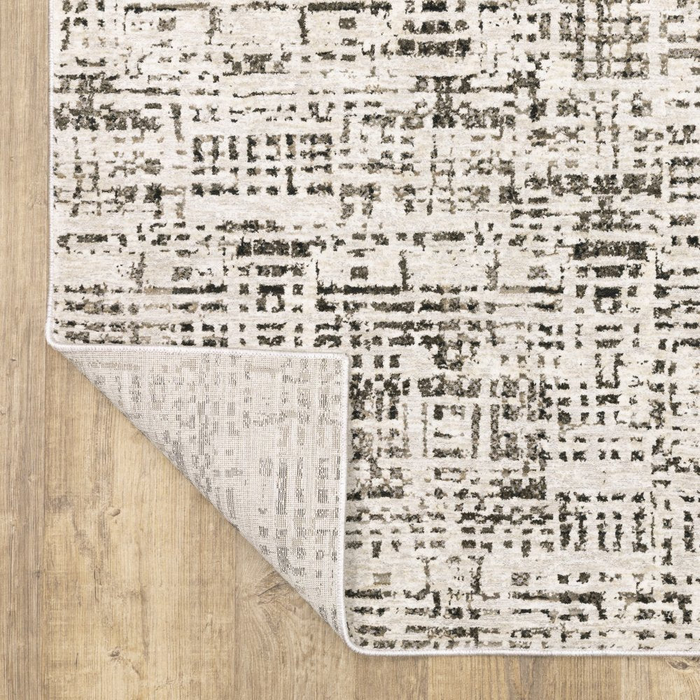 7' X 10' Ivory And Gray Abstract Area Rug