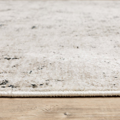 2' X 8' Ivory Grey Black Beige And Tan Abstract Power Loom Stain Resistant Runner Rug