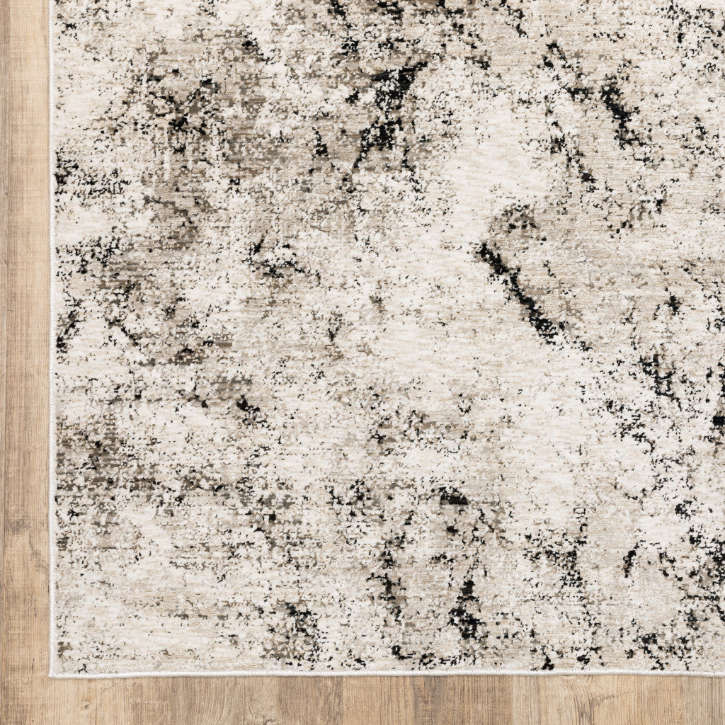 3' X 5' Ivory Grey Black Beige And Tan Abstract Power Loom Stain Resistant Area Rug