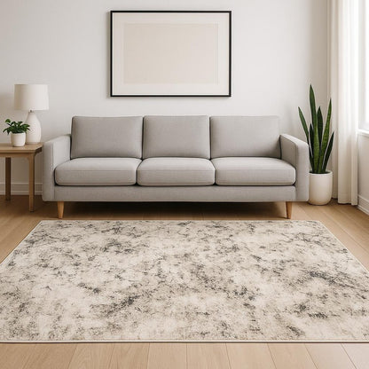 5' X 8' Ivory Grey Black Beige And Tan Abstract Power Loom Stain Resistant Area Rug