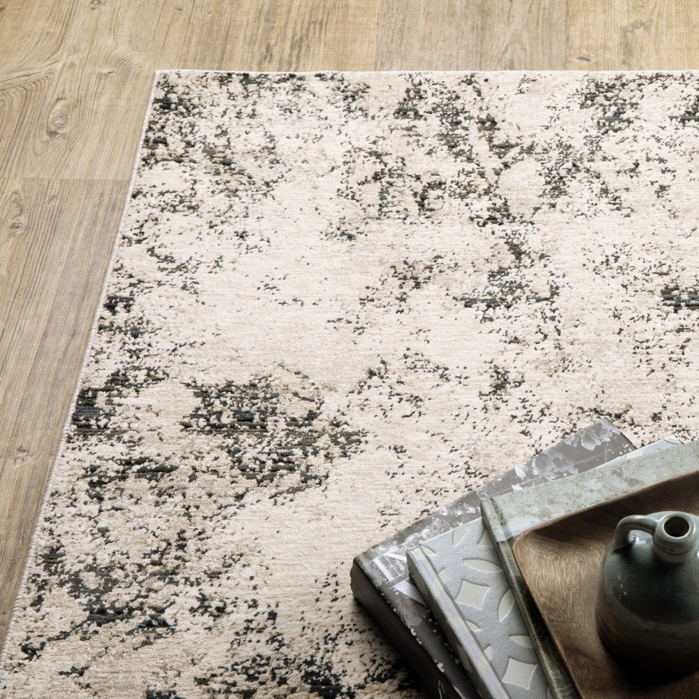 7' X 10' Ivory And Gray Abstract Area Rug