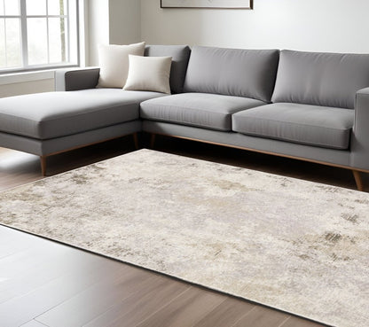 7' X 10' Ivory And Beige Abstract Distressed Area Rug