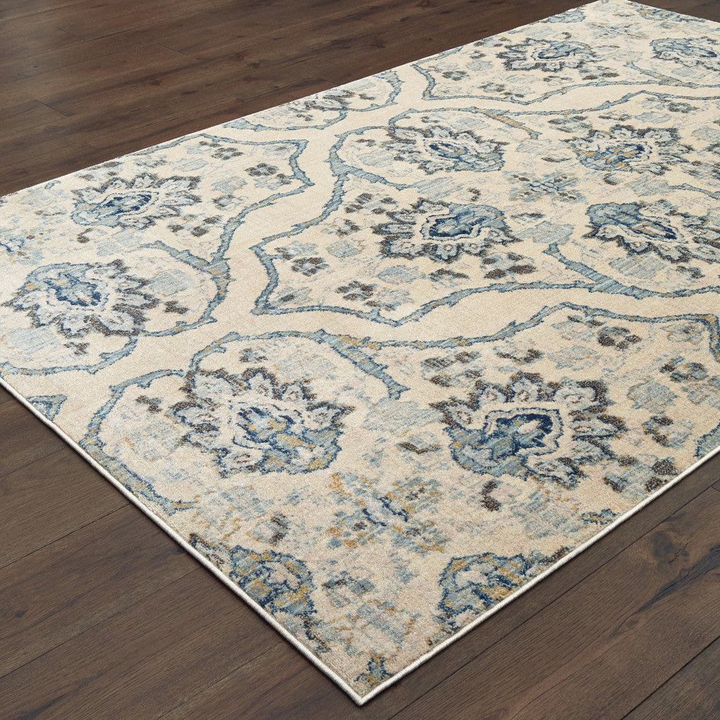 5' X 8' Ivory And Blue Floral Power Loom Stain Resistant Area Rug