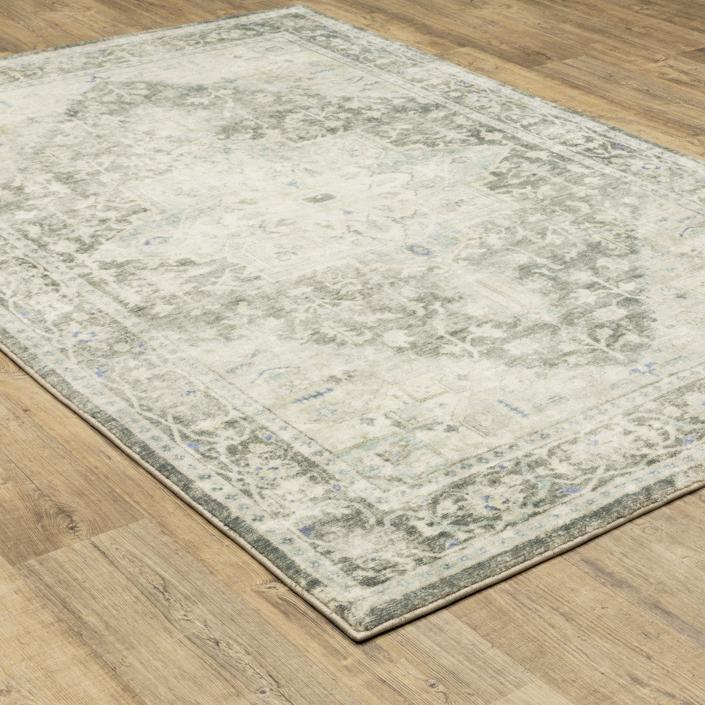 5' X 7' Grey Ivory And Blue Oriental Power Loom Stain Resistant Area Rug