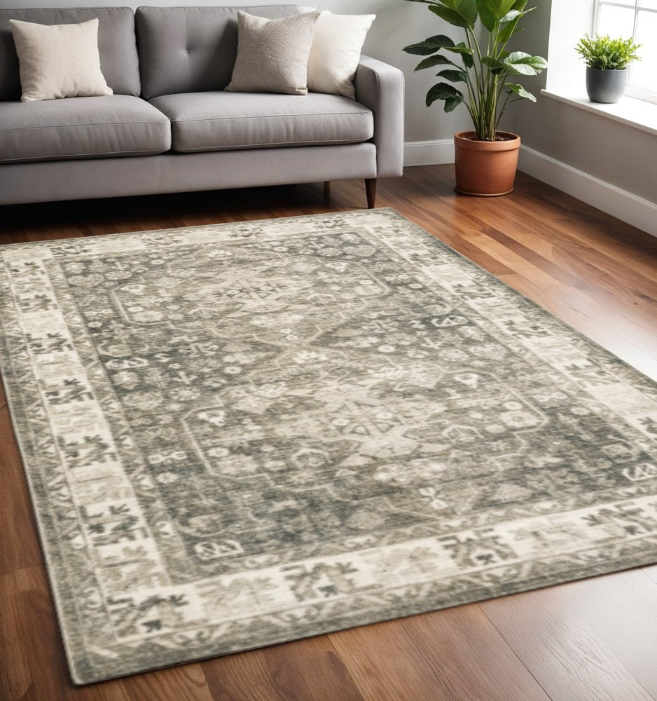 5' X 7' Grey Ivory Tan And Beige Oriental Power Loom Stain Resistant Area Rug