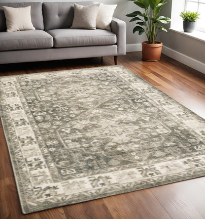 5' X 7' Grey Ivory Tan And Beige Oriental Power Loom Stain Resistant Area Rug