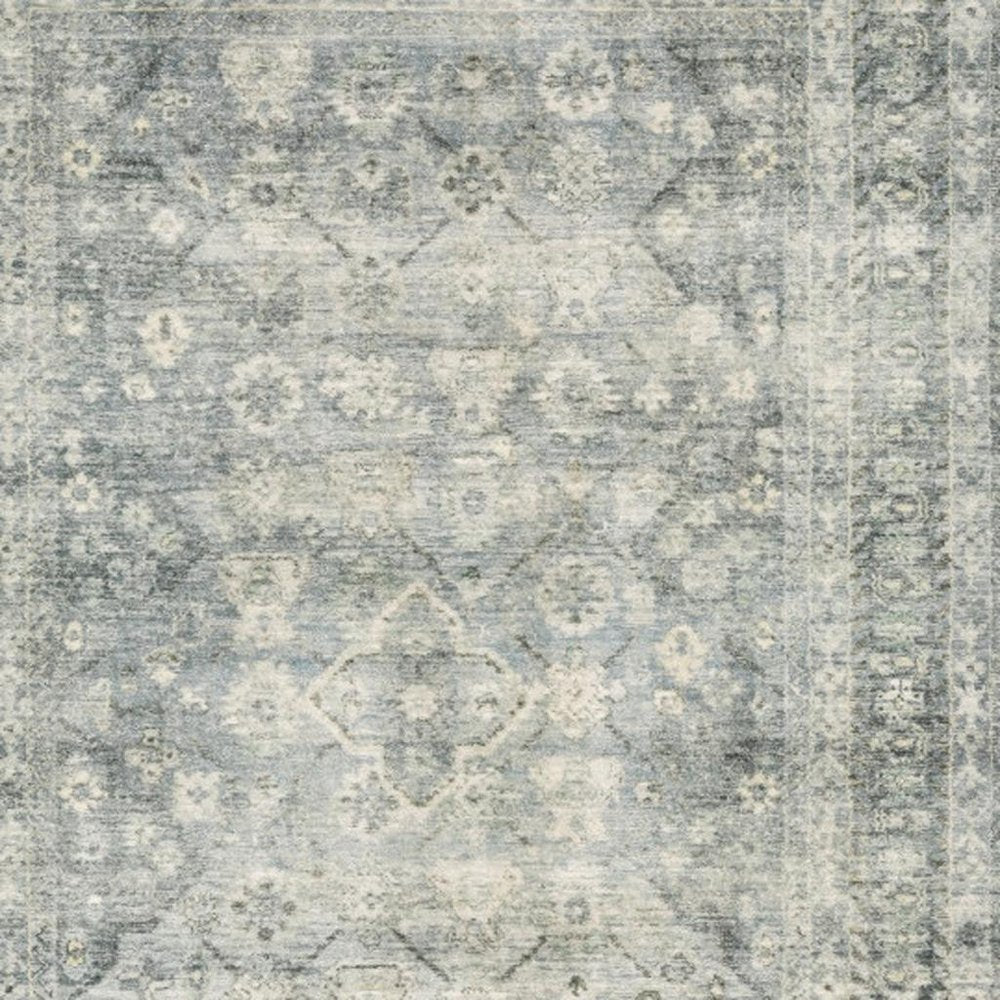 5' X 7' Blue Ivory And Grey Oriental Power Loom Stain Resistant Area Rug