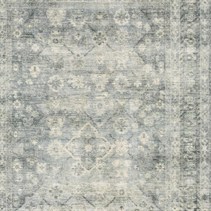 5' X 7' Blue Ivory And Grey Oriental Power Loom Stain Resistant Area Rug