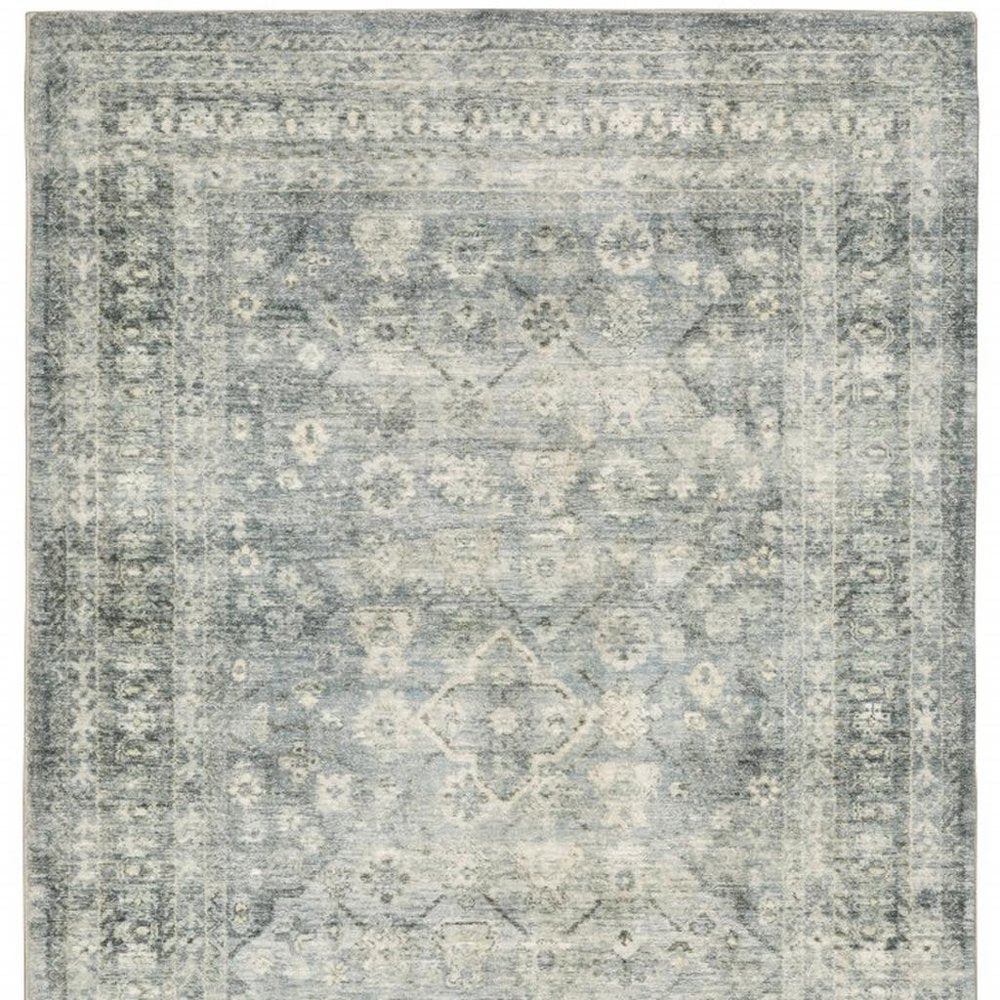 5' X 7' Blue Ivory And Grey Oriental Power Loom Stain Resistant Area Rug