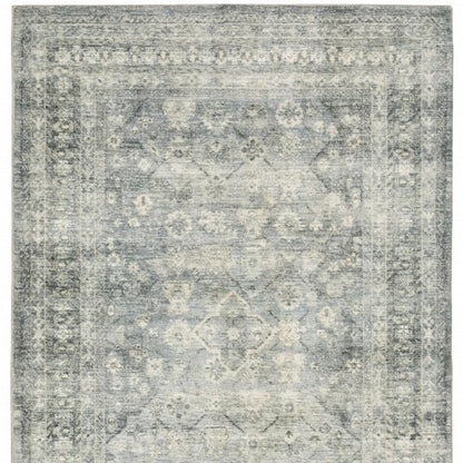 5' X 7' Blue Ivory And Grey Oriental Power Loom Stain Resistant Area Rug