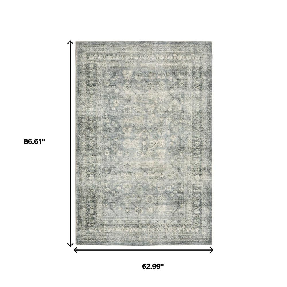 5' X 7' Blue Ivory And Grey Oriental Power Loom Stain Resistant Area Rug