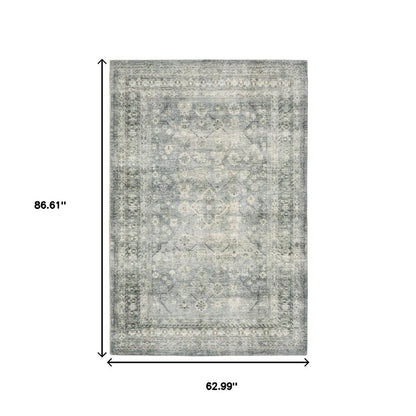 5' X 7' Blue Ivory And Grey Oriental Power Loom Stain Resistant Area Rug