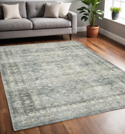 5' X 7' Blue Ivory And Grey Oriental Power Loom Stain Resistant Area Rug