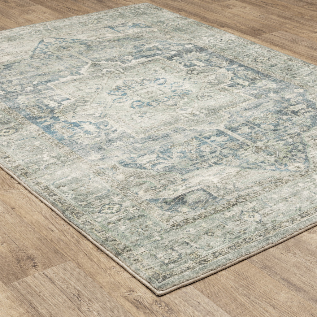 5' X 7' Grey Blue And Ivory Oriental Power Loom Stain Resistant Area Rug