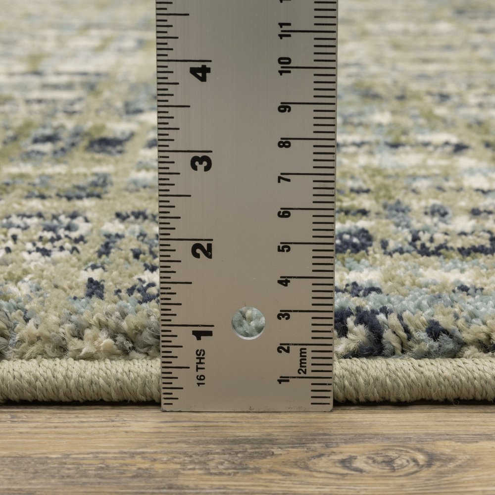 10' X 13' Green Blue Ivory Beige And Light Blue Abstract Power Loom Stain Resistant Area Rug