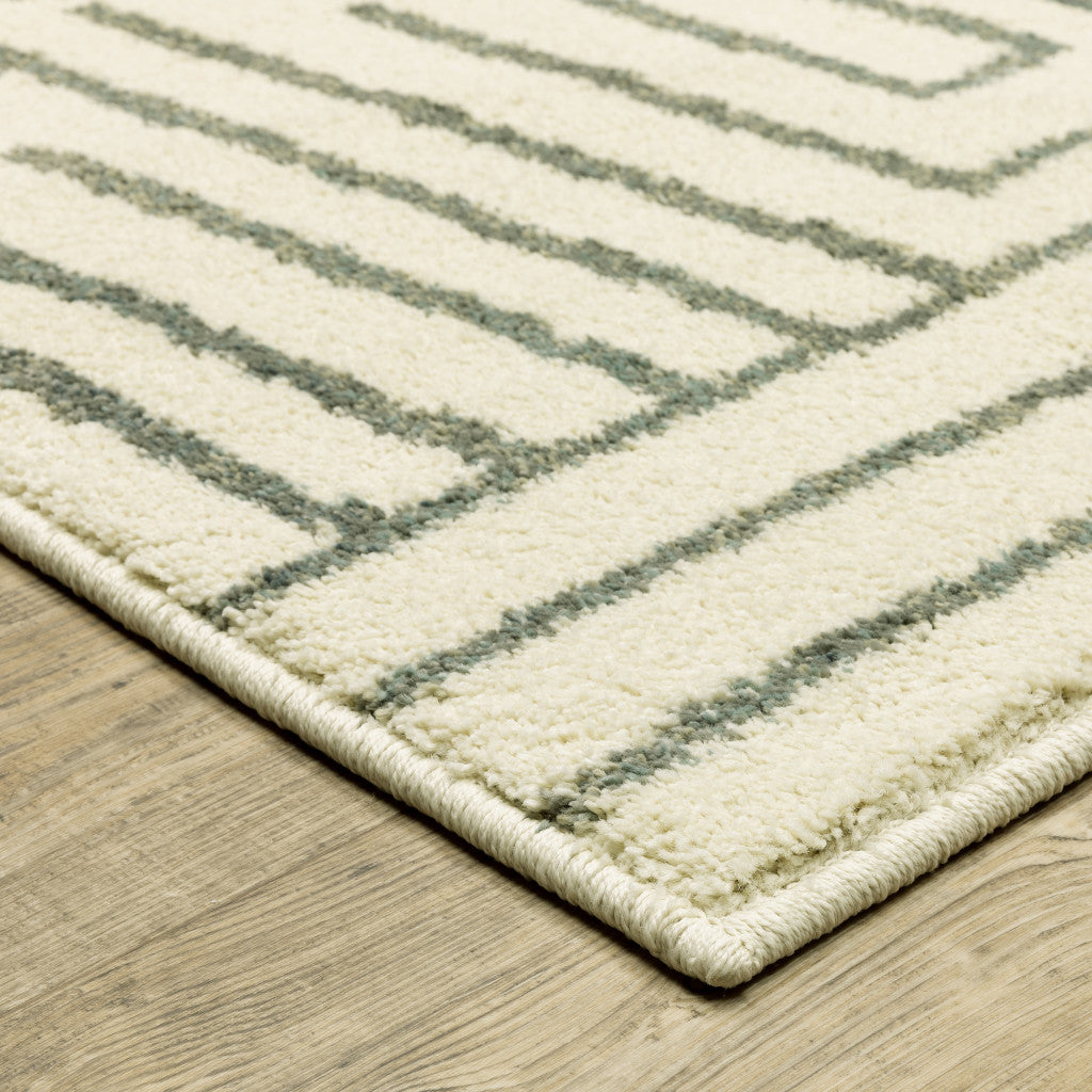 6' X 9' Beige Grey And Light Blue Geometric Power Loom Stain Resistant Area Rug