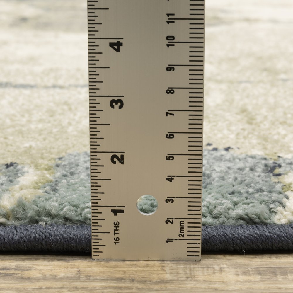 10' X 13' Blue Green And Ivory Abstract Area Rug