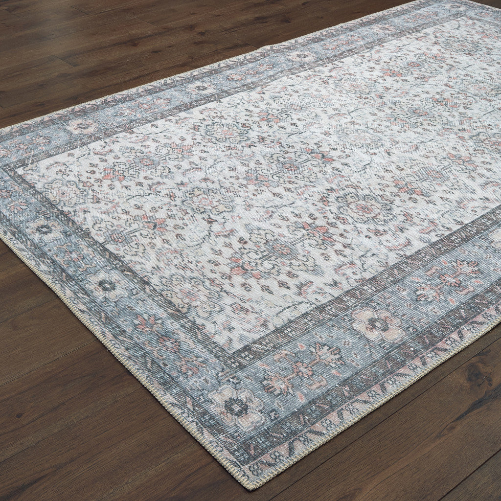 5' X 8' Ivory And Blue Oriental Power Loom Stain Resistant Area Rug