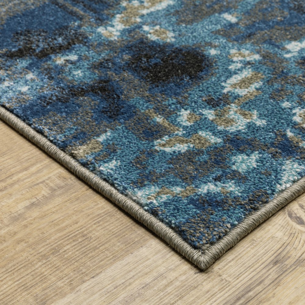 7' X 9' Blue And Beige Abstract Area Rug