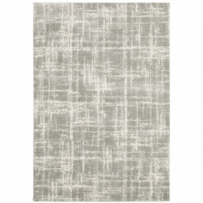 2' x 3' grey and ivory abstract shag area rug with power-loom construction and stain resistance.