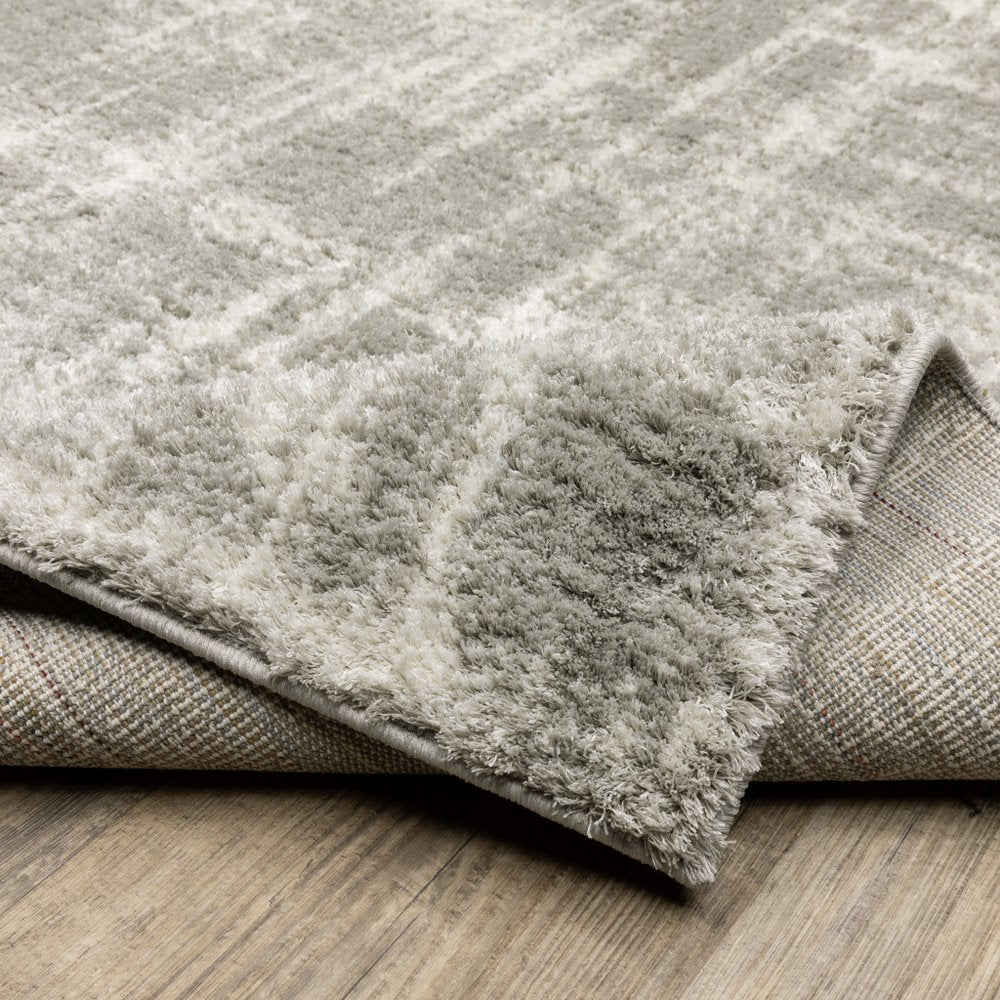 2' x 3' grey and ivory abstract shag power loom stain resistant area rug
