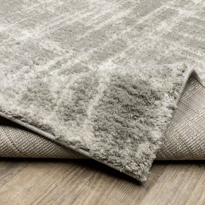 2' x 3' grey and ivory abstract shag power loom stain resistant area rug