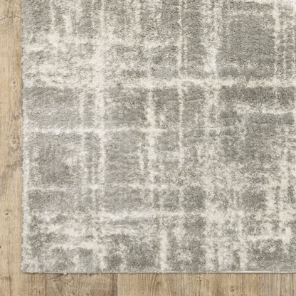 4' x 6' grey and ivory abstract shag area rug, stain-resistant, power loom construction.