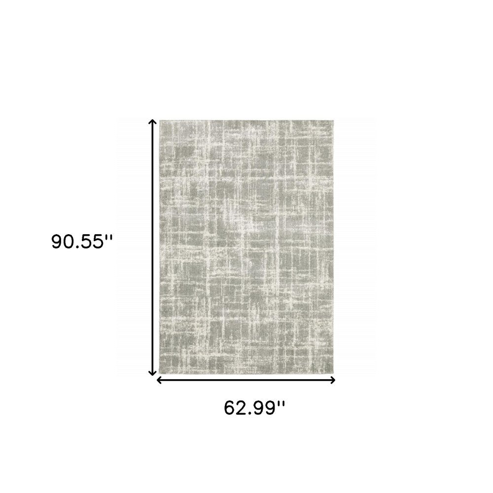 5' X 8' Grey And Ivory Abstract Shag Power Loom Stain Resistant Area Rug
