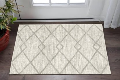 2' x 3' ivory and grey geometric shag area rug, power loom construction, stain-resistant.