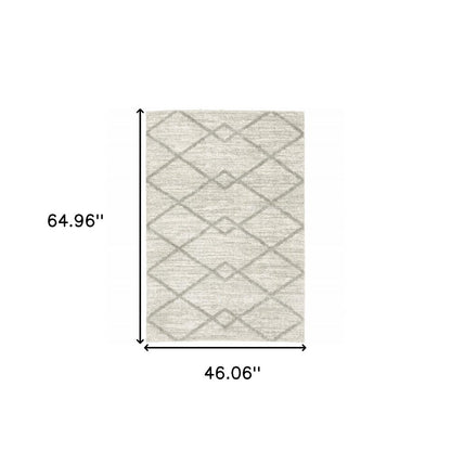 4' X 6' Ivory And Grey Geometric Shag Power Loom Stain Resistant Area Rug
