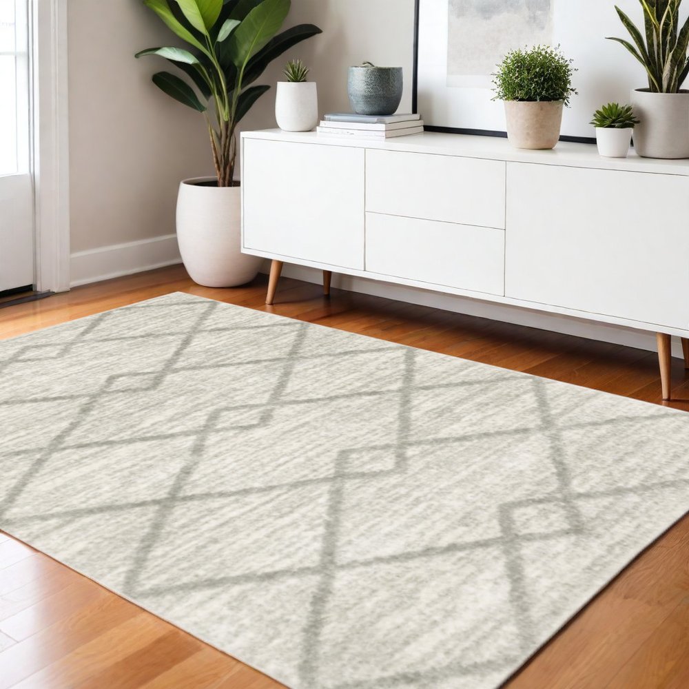 4' x 6' Ivory and Grey Geometric Shag Power Loom Stain Resistant Area Rug