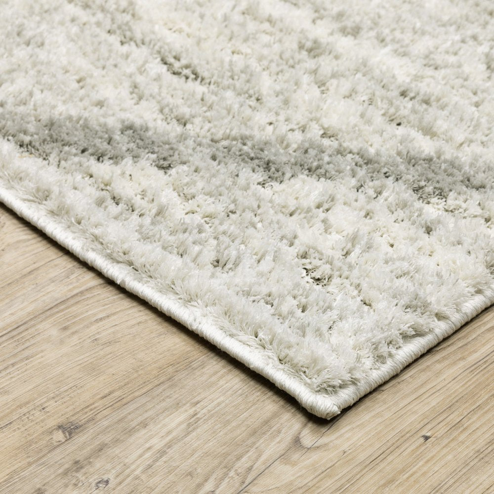 4' x 6' ivory and grey geometric shag area rug, power loom, stain resistant.