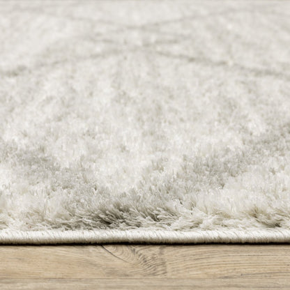 5' x 8' ivory and grey geometric shag area rug, power-loomed, stain resistant.
