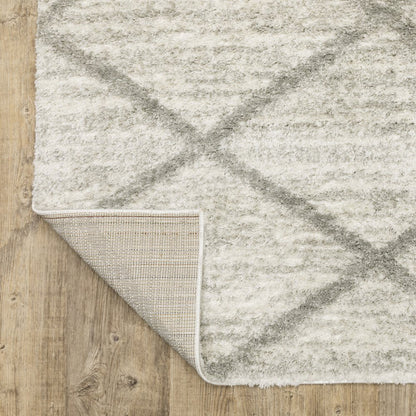 5' x 8' Ivory and Grey Geometric Shag Power Loom Stain Resistant Area Rug