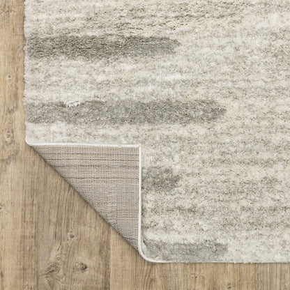 2' x 3' Ivory and Grey Geometric Shag Power Loom Stain Resistant Area Rug