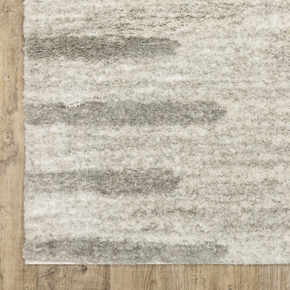 2' x 3' Ivory and Grey Geometric Shag Power Loom Stain Resistant Area Rug