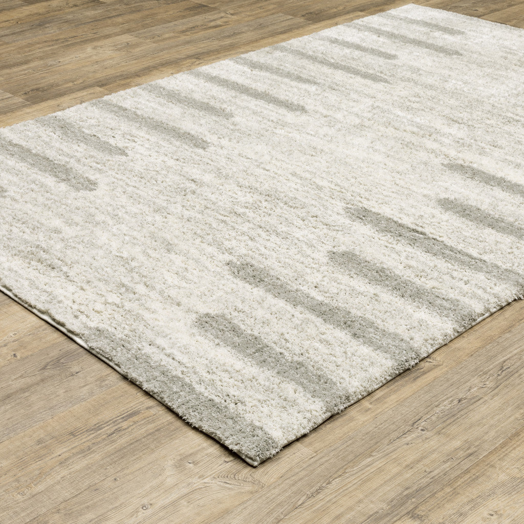 5' X 8' Ivory And Grey Geometric Shag Power Loom Stain Resistant Area Rug