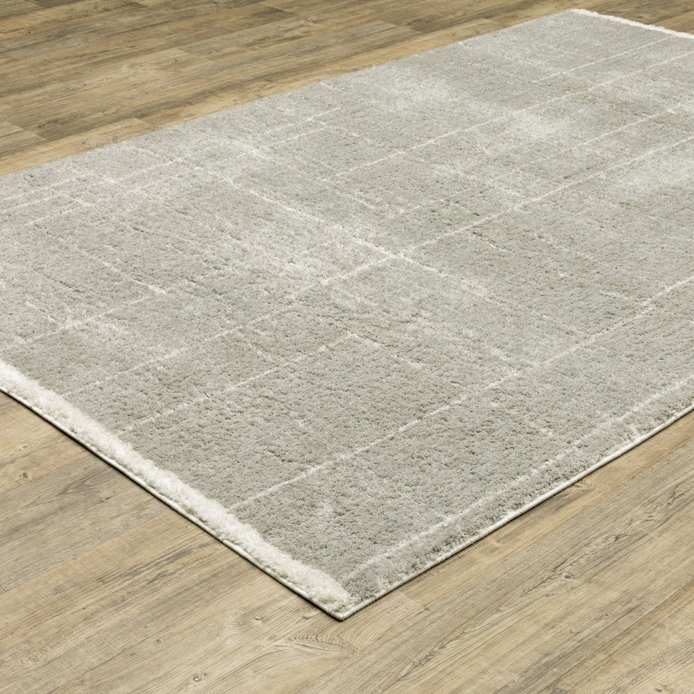 6' X 9' Grey And Ivory Geometric Shag Power Loom Stain Resistant Area Rug